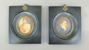 A pair of black-framed miniatures. 11 cm wide.