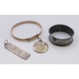A silver St Christopher pendant, a silver ingot pendant,