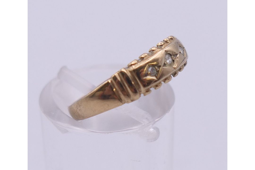 A 9 ct gold three stone diamond ring. Ring size L. 1.3 grammes total weight. - Image 7 of 7