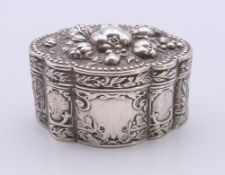 A Continental embossed silver box. 94.8 grammes. 4 cm high.