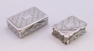 A Georgian silver vinaigrette and a Victorian silver vinaigrette. The larger 3.5 x 2.5 cm.