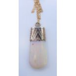 An unmarked 9 ct gold mounted opal pendant on a 9 ct gold chain. Pendant 3.