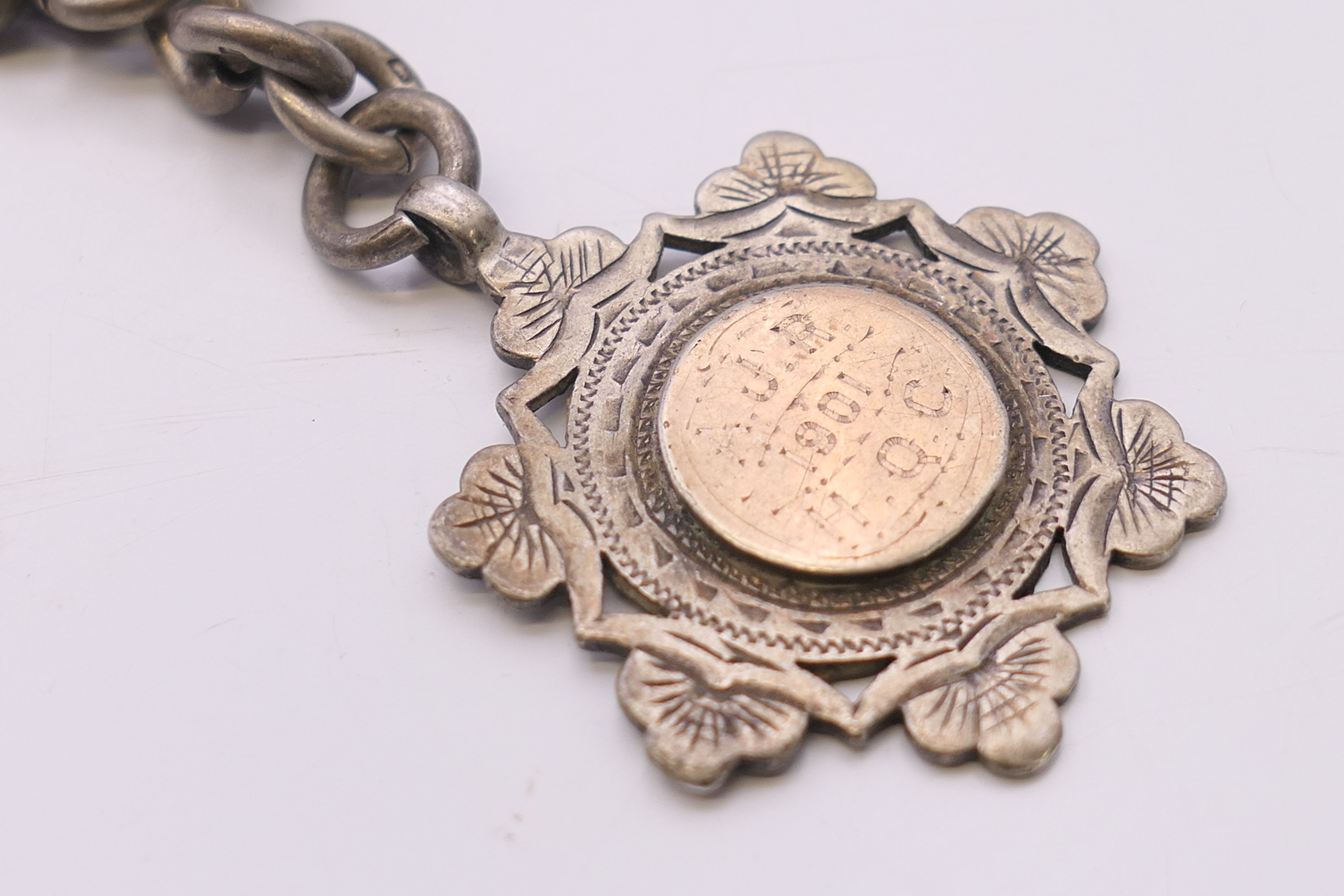A silver Albert pocket watch chain and fob, the fob engraved AJR 1901 HQC. 38 cm long, fob 3. - Image 3 of 6