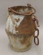 A vintage riveted metal well bucket. 48 cm high.