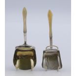 Two Georgian mother-of-pearl handled silver caddy spoons. 9 cm and 9.5 cm high respectively.