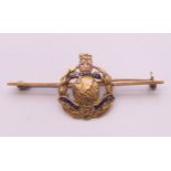 A 9 ct gold Royal Marines 'Gibraltar per mare per terram' brooch, boxed. 5 cm long, 2 cm high. 4.