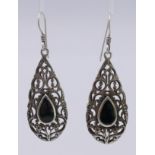 A pair of silver earrings set with black onyx. 4 cm high.