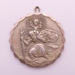 A silver St Christopher pendant. 33.5 grammes. 4 cm diameter.