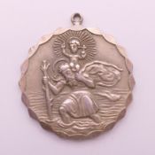 A silver St Christopher pendant. 33.5 grammes. 4 cm diameter.