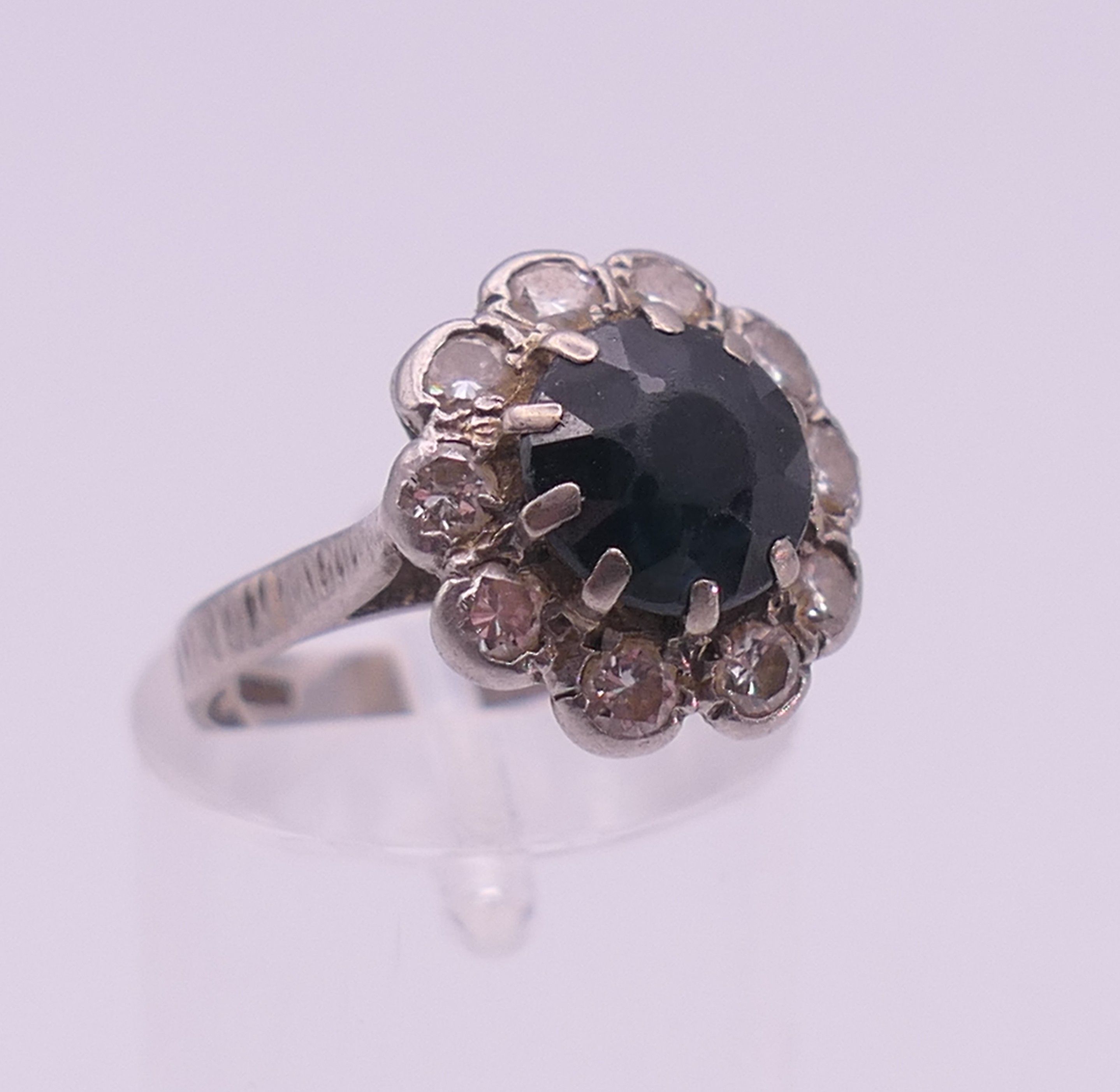 A platinum diamond and sapphire ring. Ring size H. - Image 8 of 8