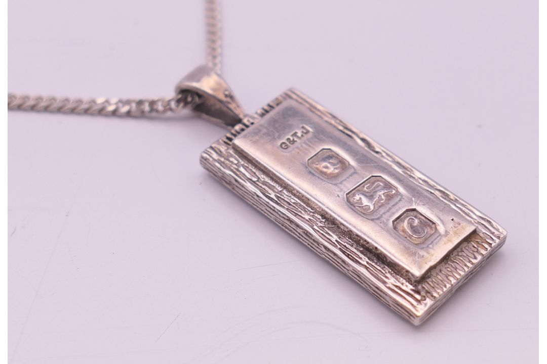 A silver ingot pendant on a silver chain. - Image 3 of 6