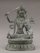 A patinated model of Bodhisattva Manjushri. 34 cm high.