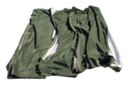 Four dark green velvet lined curtains with two matching tiebacks. Each 215 cm high x 110 cm wide.