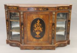 A 19th century ormolu-mounted marquetry inlaid walnut credenza. 166 cm wide.