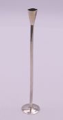 A silver taper stick. 10 grammes. 14.5 cm high.