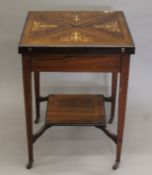 A Victorian inlaid rosewood envelope card table. 55.5 cm squared.