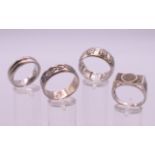 Four gentlemen's heavy silver rings. Ring sizes S/T and above.
