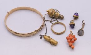 A quantity of various jewellery, to include: a 1/5th 9 ct gold bangle, a coral grapevine brooch,