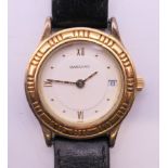 A Garrard gold plated sterling silver one one two quartz calendar vermeil ladies wristwatch,