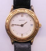A Garrard gold plated sterling silver one one two quartz calendar vermeil ladies wristwatch,