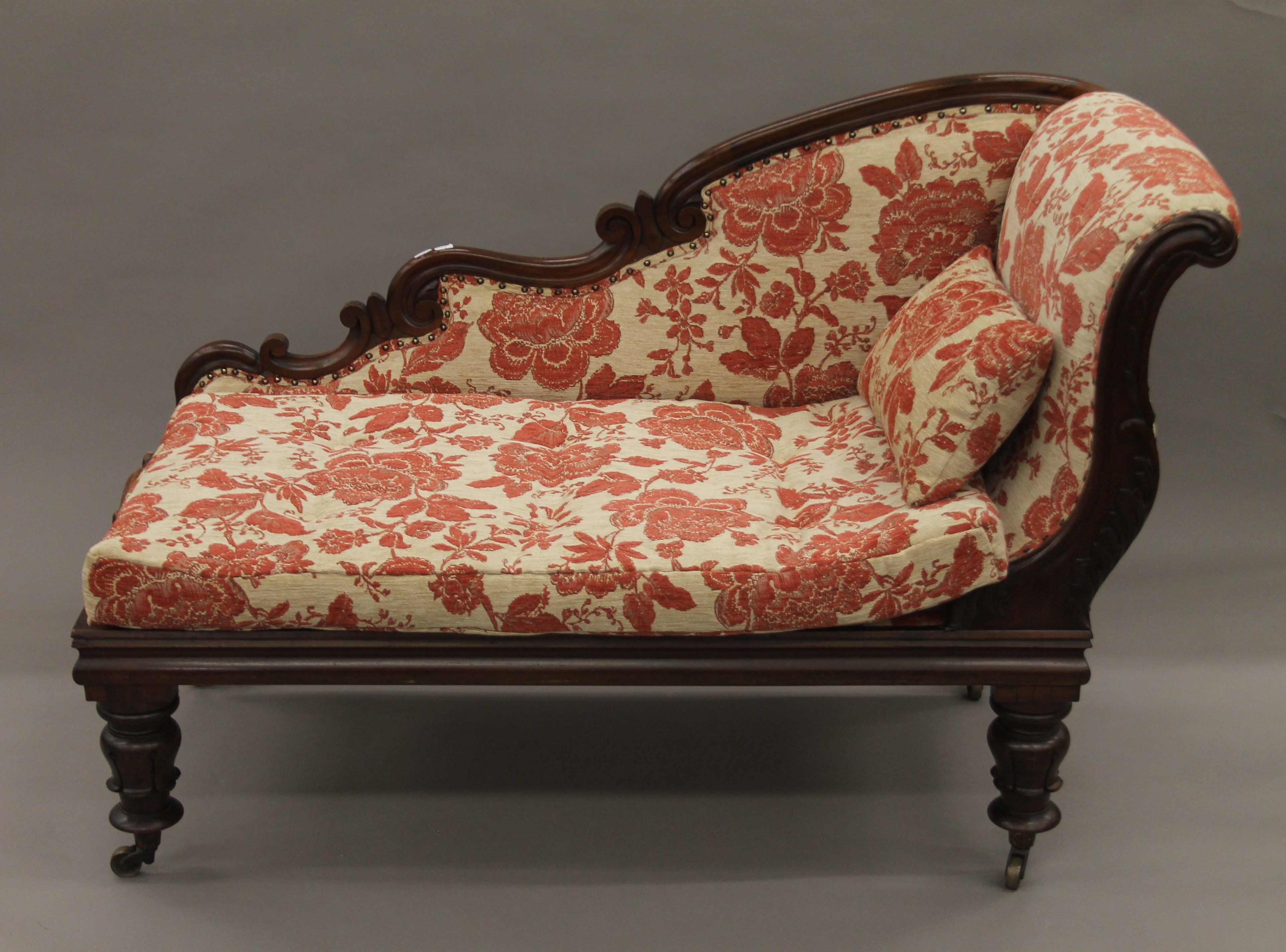 A 19th century mahogany upholstered chaise lounge. 125 cm long.