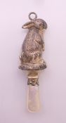 A mother-of-pearl and silver bunny rabbit rattle. 7.5 cm high.