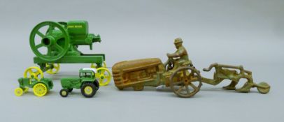 A quantity of 'John Deere' model tractors. The largest 15 cm long.