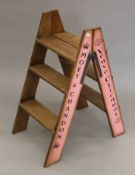 A wooden 'Champagne' step ladder. 83 cm high.
