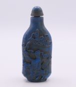 A Chinese blue snuff bottle and stopper. 8.5 cm high.
