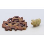 A jade pig and a jade pendant carving. Pig 2.5 cm high, pendant 9.5 x 8.5 cm.