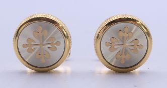 A pair of Patek Phillipe cufflinks in a Hacket of London box. 1.8 cm diameter.
