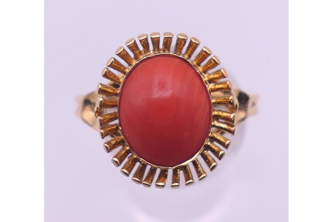 An 18 ct gold coral ring. Ring size V. 5.3 grammes total weight. - Image 1 of 5
