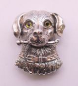 A silver spaniel brooch/pendant. 3 cm high.