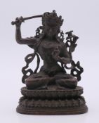 A Chinese bronze model of Bodhisattva Manjushri. 9.5 cm high.