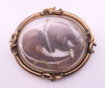 A Victorian mourning brooch/pendant. 5 cm high.