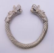 A Chinese silver plated dragon bangle. 9.5 cm exterior diameter.