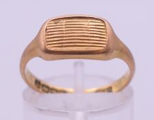 An 18 ct gold ring. Ring size N. 4.1 grammes.