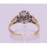 An 18 ct gold diamond ring. The central stone spreading to approximately 0.25 of a carat.