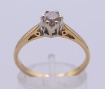 An 18 K gold and diamond solitaire ring. The stone spreading to approximately 0.25 of a carat.