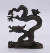 A bronze model of a dragon. 8 cm high.