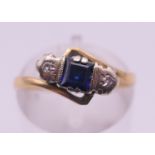 An 18 ct gold, sapphire and diamond ring. Ring size L. 3.3 grammes total weight.
