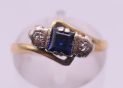 An 18 ct gold, sapphire and diamond ring. Ring size L. 3.3 grammes total weight.