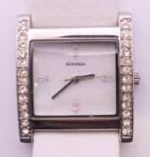 A Sekonda 4823 ladies rectangular wristwatch set with stones. 2.75 x 3 cm.