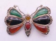 A silver butterfly brooch. 4 cm wide.