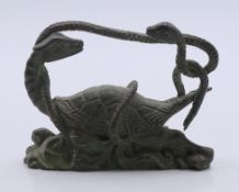 A bronze model of a tortoise and a snake. 6.5 cm long.