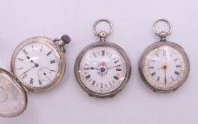 Three silver fob watches. Largest 3.75 cm diameter.