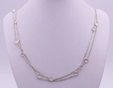 A moonstone necklace. 146 cm long.