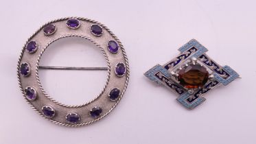 A 19th century Scottish circular silver cloak pin set with twelve faceted amethysts,