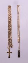 Two 9 ct gold pendant necklaces - one diamond set, the other a cross. The diamond pendant 2 cm high.