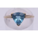 A 9 ct gold blue stone ring. Ring size M/N.